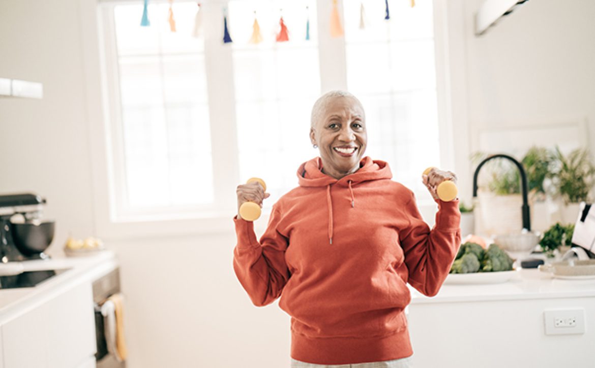 Senior women taking care of herself  she exercise with  dumbbells at home